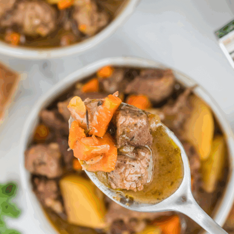 Bowl of homemade Copycat Cracker Barrel beef stew with beef, carrots, and potatoes.