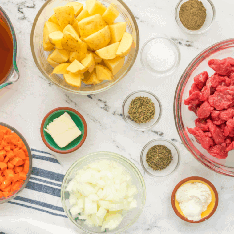 Ingredients needed for Copycat Cracker Barrel Beef Stew on kitchen table.