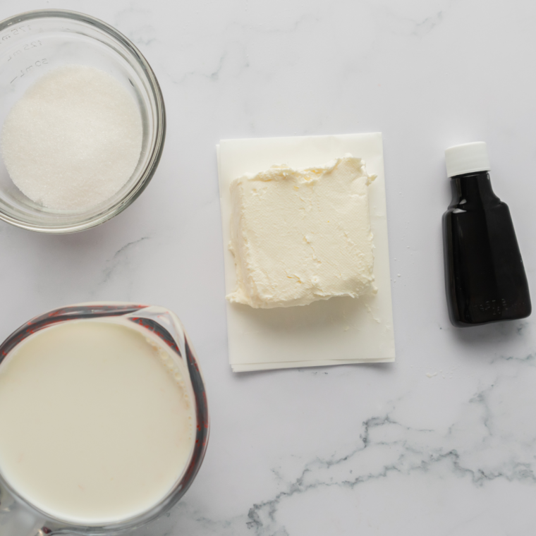 Ingredients needed for Ninja Creami Vanilla Soft Serve on kitchen table.