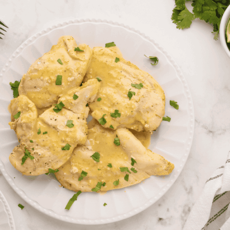 Thai Coconut Lime Chicken inspired by Cheesecake Factory, with tender chicken in creamy coconut-lime sauce garnished with fresh herbs.