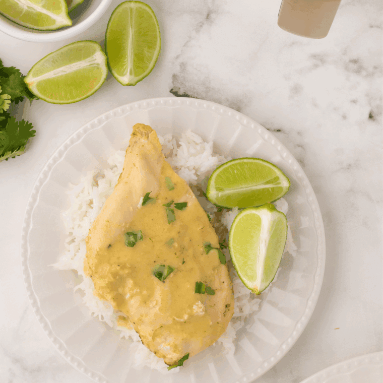 Thai Coconut Lime Chicken inspired by Cheesecake Factory, served with creamy coconut-lime sauce and garnished with fresh herbs.