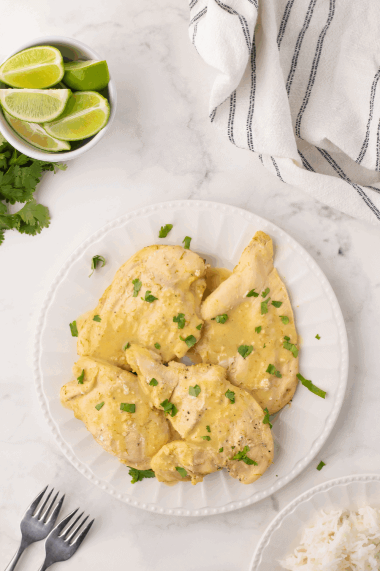Thai Coconut Lime Chicken inspired by Cheesecake Factory, featuring tender chicken in creamy coconut-lime sauce garnished with fresh herbs.
