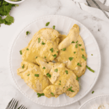 Thai Coconut Lime Chicken inspired by Cheesecake Factory, featuring tender chicken in creamy coconut-lime sauce garnished with fresh herbs.