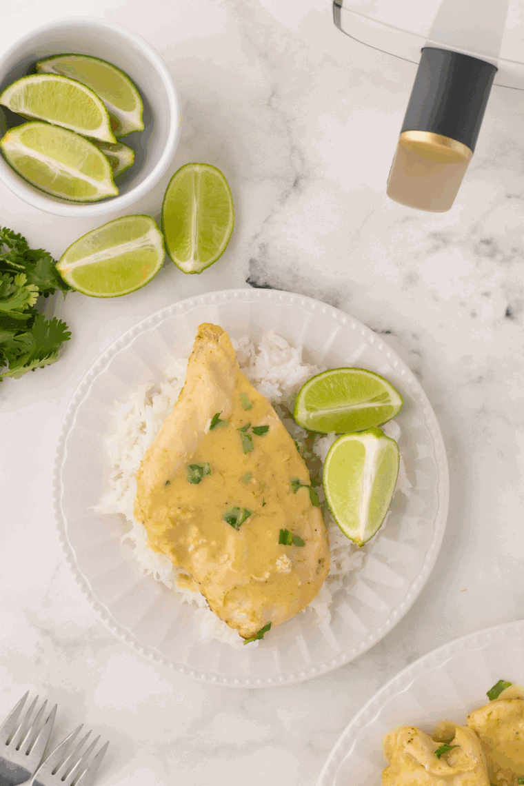 Homemade Thai Coconut Lime Chicken Cheesecake Factory copycat served with creamy coconut-lime sauce and fresh herbs.