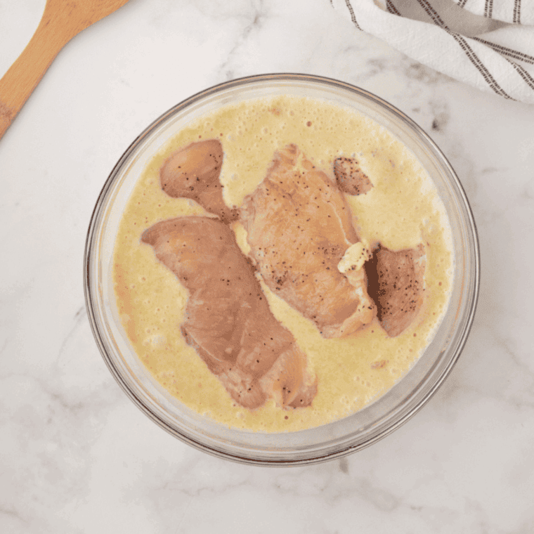 Marinaded Thai Coconut Lime Chicken Cheesecake Factory in a large mixing bowl.