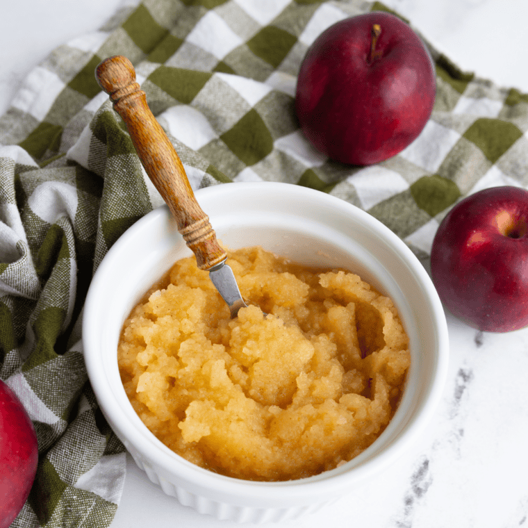 Homemade air fryer applesauce in a bowl, smooth and ready to serve.