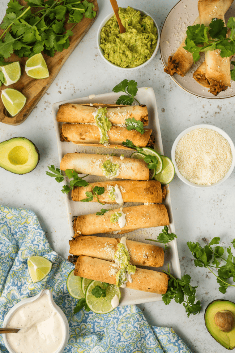 Golden, crispy Air Fryer Pulled Pork Taquitos filled with flavorful pulled pork and cheese.