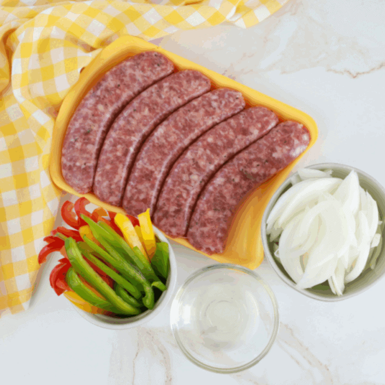 Ingredients needed for Golden Corral Sausage and Peppers on kitchen table.