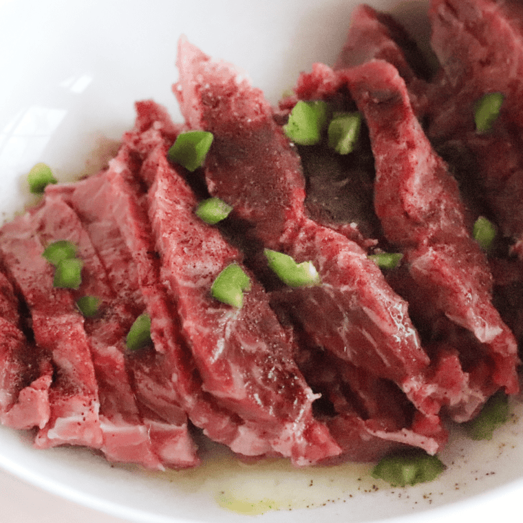 Ninja Foodi Grill Flank Steak with sauce in bowl