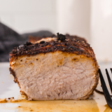 Juicy, sliced pork tenderloin cooked in a Ninja Foodi, ready to serve