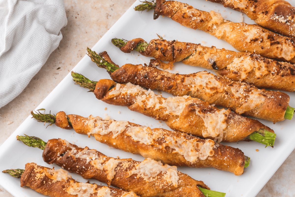 Air fryer asparagus crescent rolls on a plate.