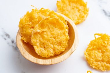 Air fryer parmesan crisps in a bowl.