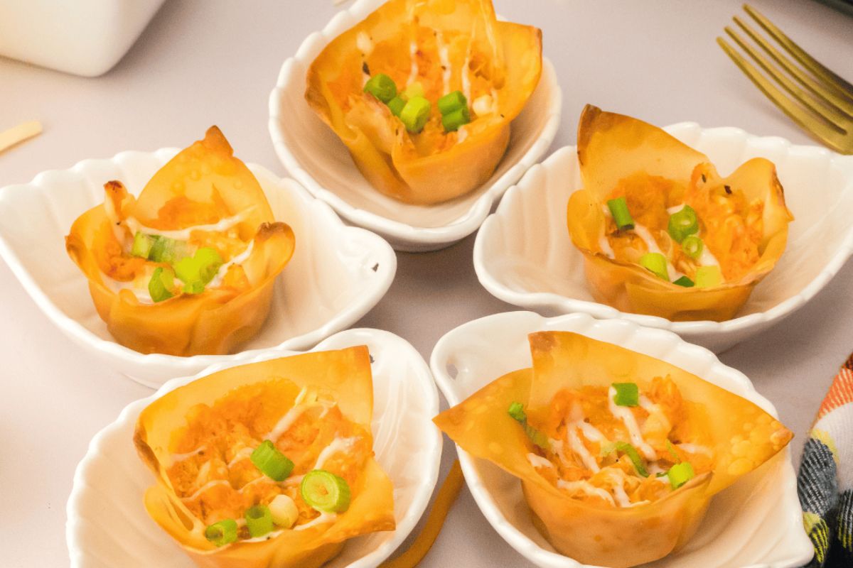 Buffalo chicken wontons on a plate.