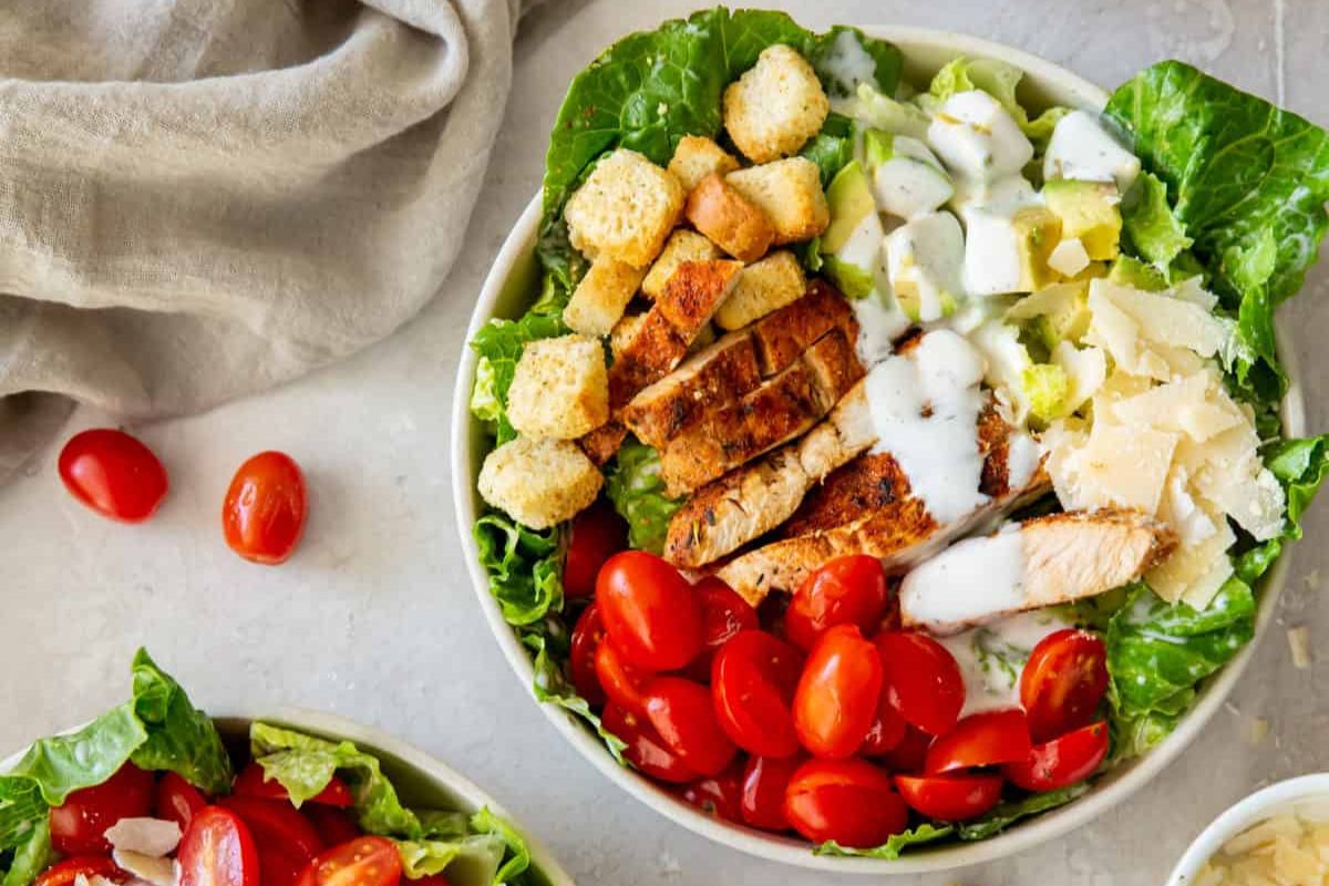 Chicken caeser salad in a bowl.