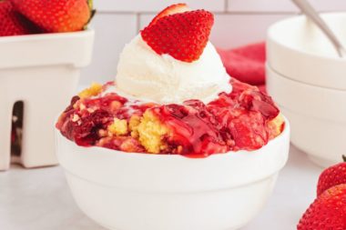 Strawberry dump cake in a bowl.