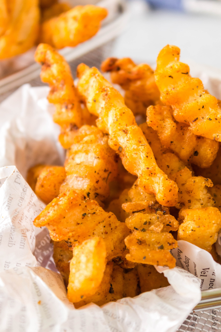 "Close-up of golden brown Copycat Popeyes Cajun Fries ready to serve."