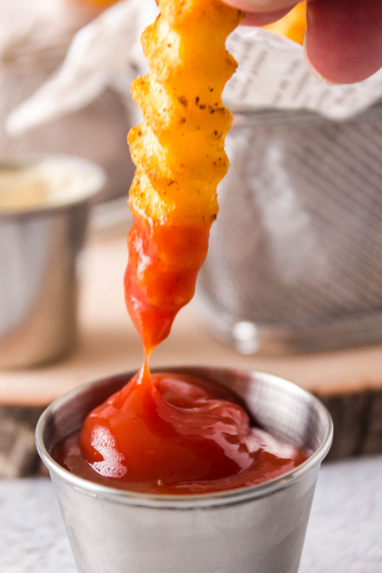 "Close-up of golden brown Copycat Popeyes Cajun Fries ready to serve."