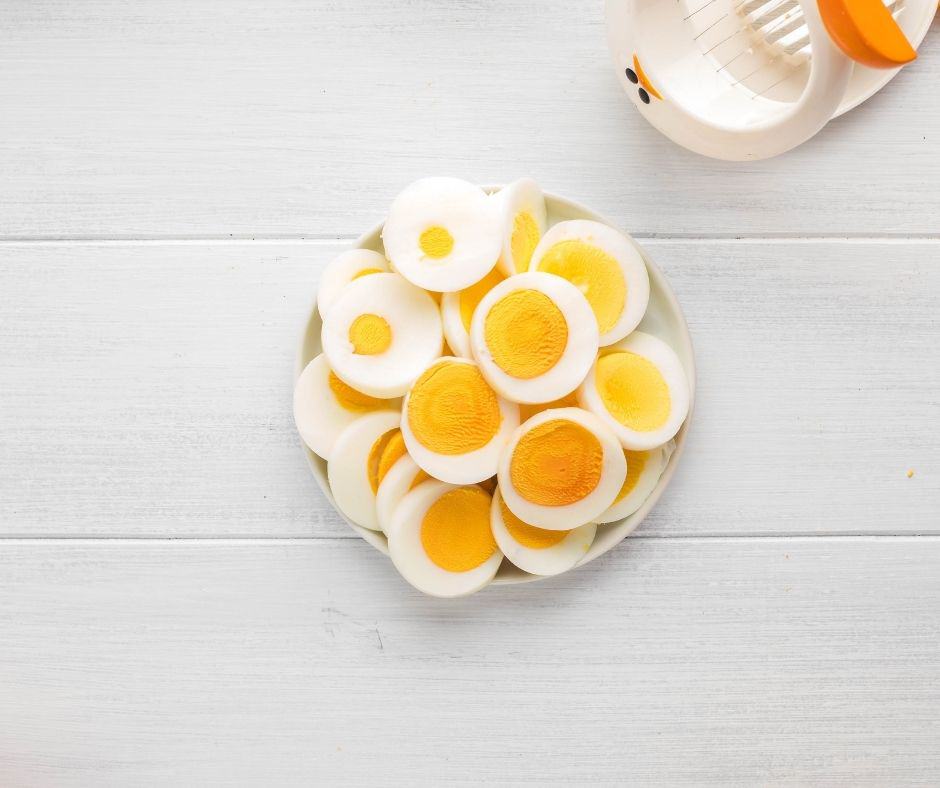 overhead: several sliced pieces of air fryer hard boiled eggs in a bowl