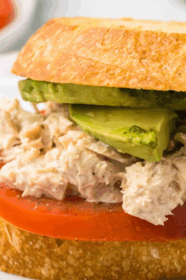 Delicious Copycat Panera Tuna Salad Sandwich made with creamy tuna salad, fresh vegetables, and soft bread.