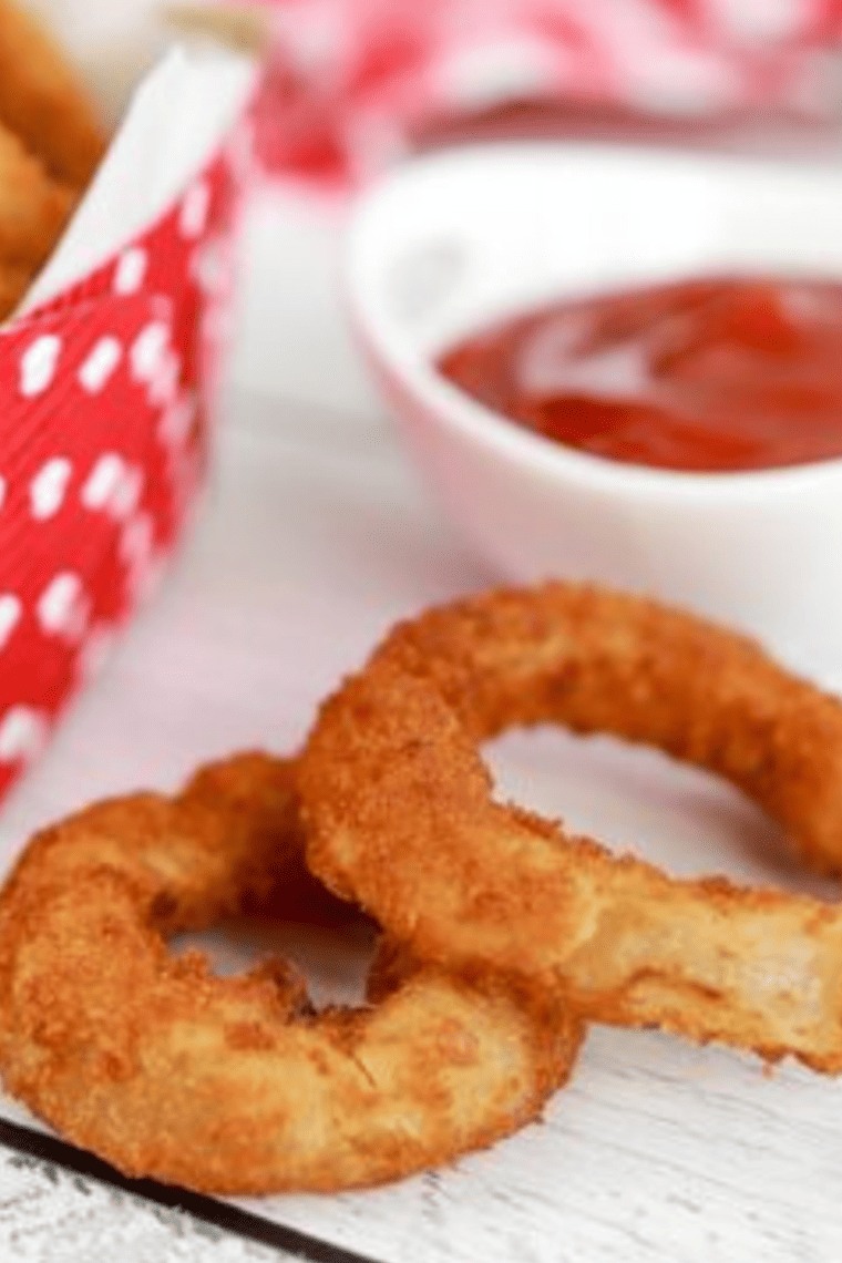 extreme closeup: two air fryer frozen onion rings 