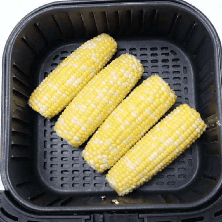 overhead: corn on the cob in air fryer basket