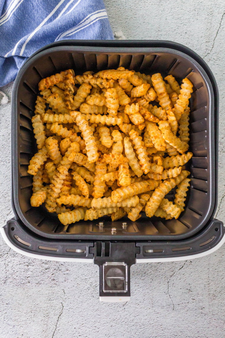 Place the coated fries in the air fryer basket.