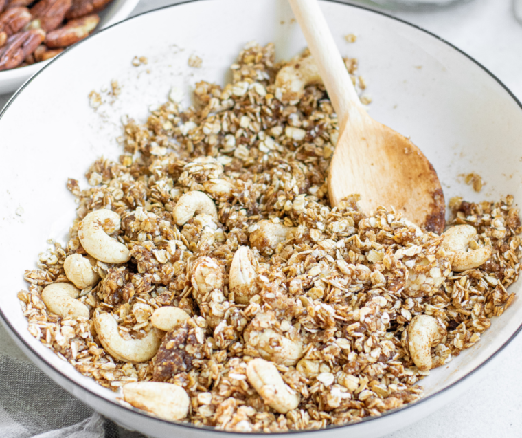 Mix wet and dry ingredients for Muesli in a large white mixing bowl