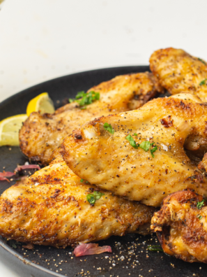 Plate of steakhouse seasoned chicken wings on a plate