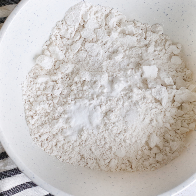 Mixing bowl, filled with Air Fryer Snowball Cookies ingredients. 