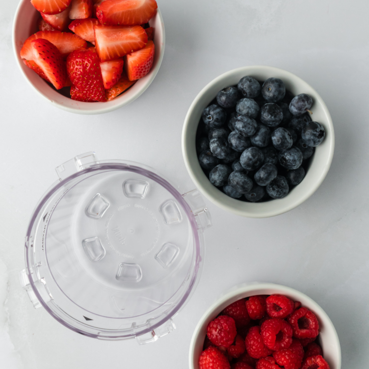 Ninja Creami Mixed Berry Sorbet ingredients on a white table.