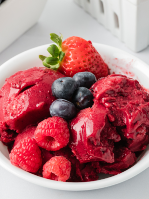 "Delicious Ninja Creami Mixed Berry Sorbet served in a bowl, garnished with fresh berries on top."