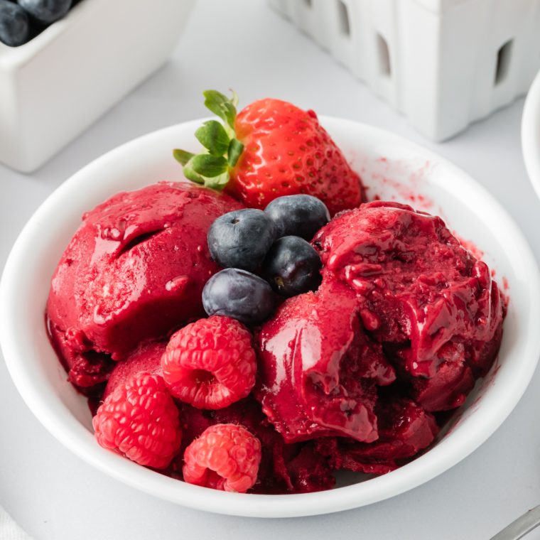 "Delicious Ninja Creami Mixed Berry Sorbet served in a bowl, garnished with fresh berries on top."