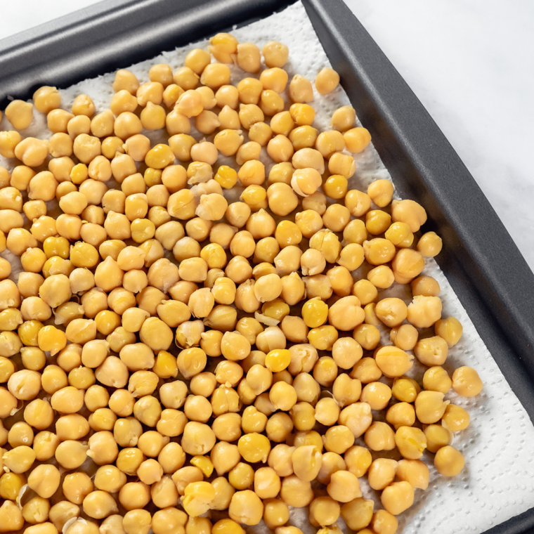 Drained and rinsed chickpeas in a bowl ready for seasoning