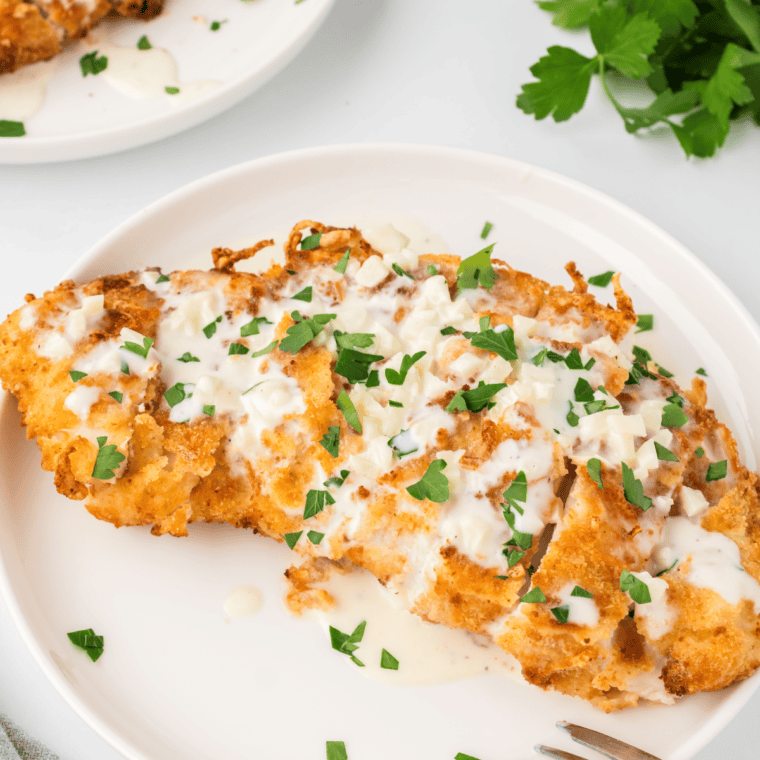 A plate of golden, crispy homemade Crispy Chicken Fritta, an Olive Garden copycat recipe.