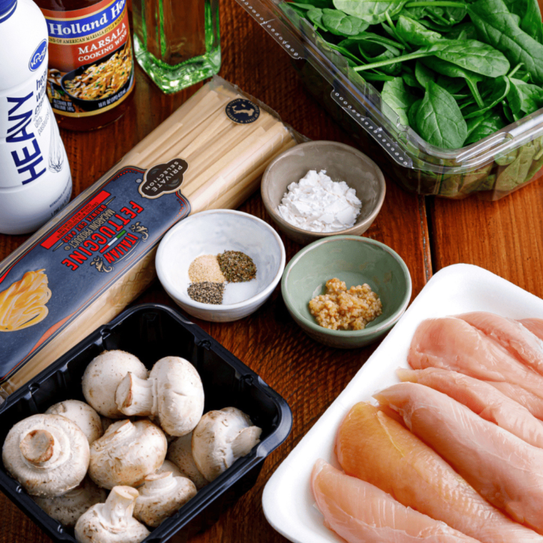 Ingredients needed for Copycat Olive Garden Creamy Mushroom Sauce on kitchen table.