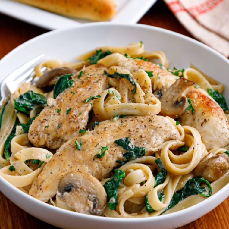 "Close-up of creamy mushroom sauce in a skillet, a copycat of Olive Garden's recipe."