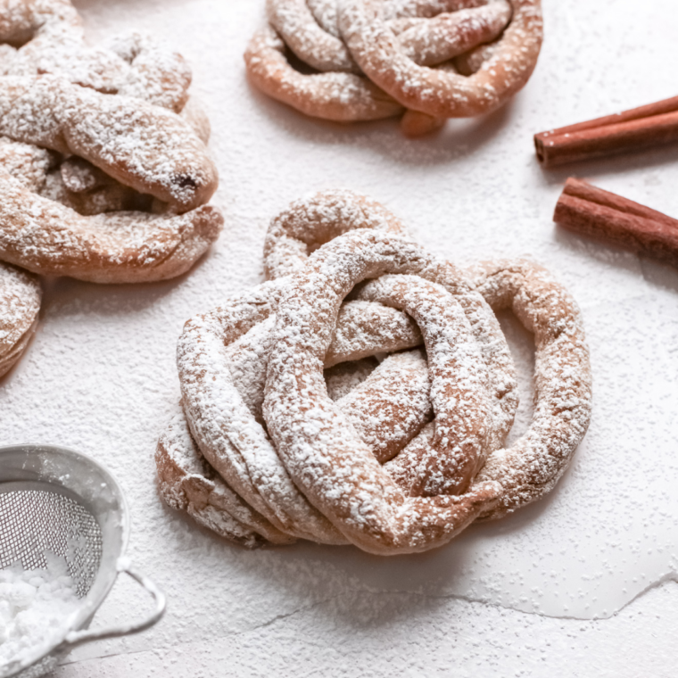  A close-up view of reheated funnel cakes in the air fryer, highlighting their golden-brown texture and crispy exterior.