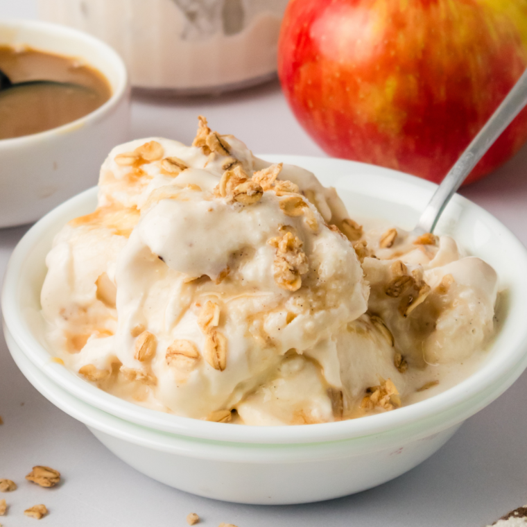 "Close-up of a bowl of Ninja Creami Apple Cobbler Ice Cream with spiced apples and a creamy, smooth texture."