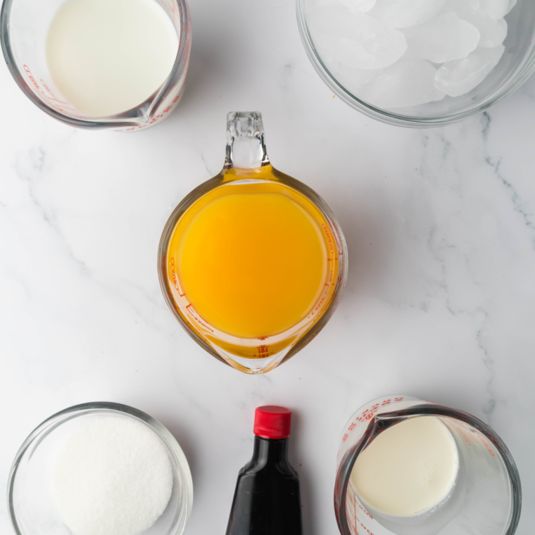 Ingredients needed for Ninja Creami Orange Julius (Copycat Recipe) on kitchen table.