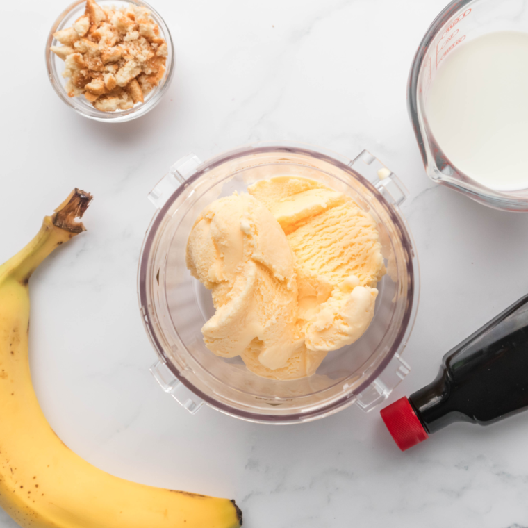 Ingredients needed for Ninja Creami Sonic Banana Shake on kitchen table.