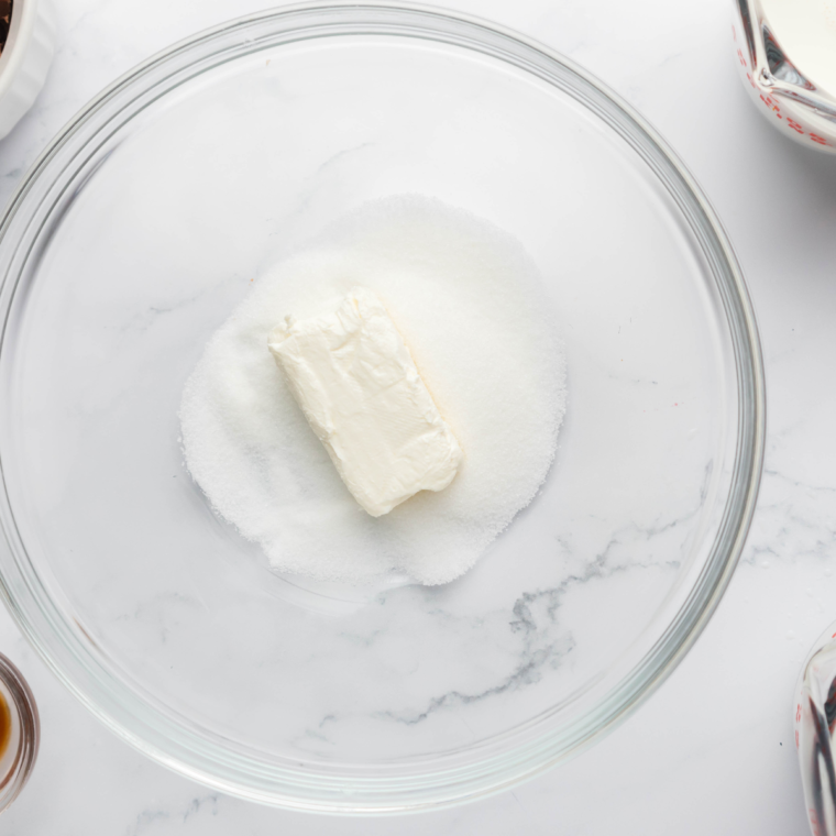 Softened cream cheese in a bowl for Ninja Creami Sonic Blast base.