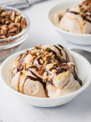 Close-up of a creamy Ninja Creami Turtle Pecan Cluster Blizzard with caramel swirls and crunchy pecans.