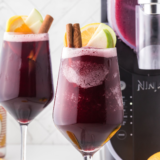 "Close-up of Ninja Slushi Sangria Wine Slushie in a glass garnished with fresh fruit"