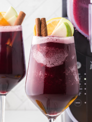 "Close-up of Ninja Slushi Sangria Wine Slushie in a glass garnished with fresh fruit"