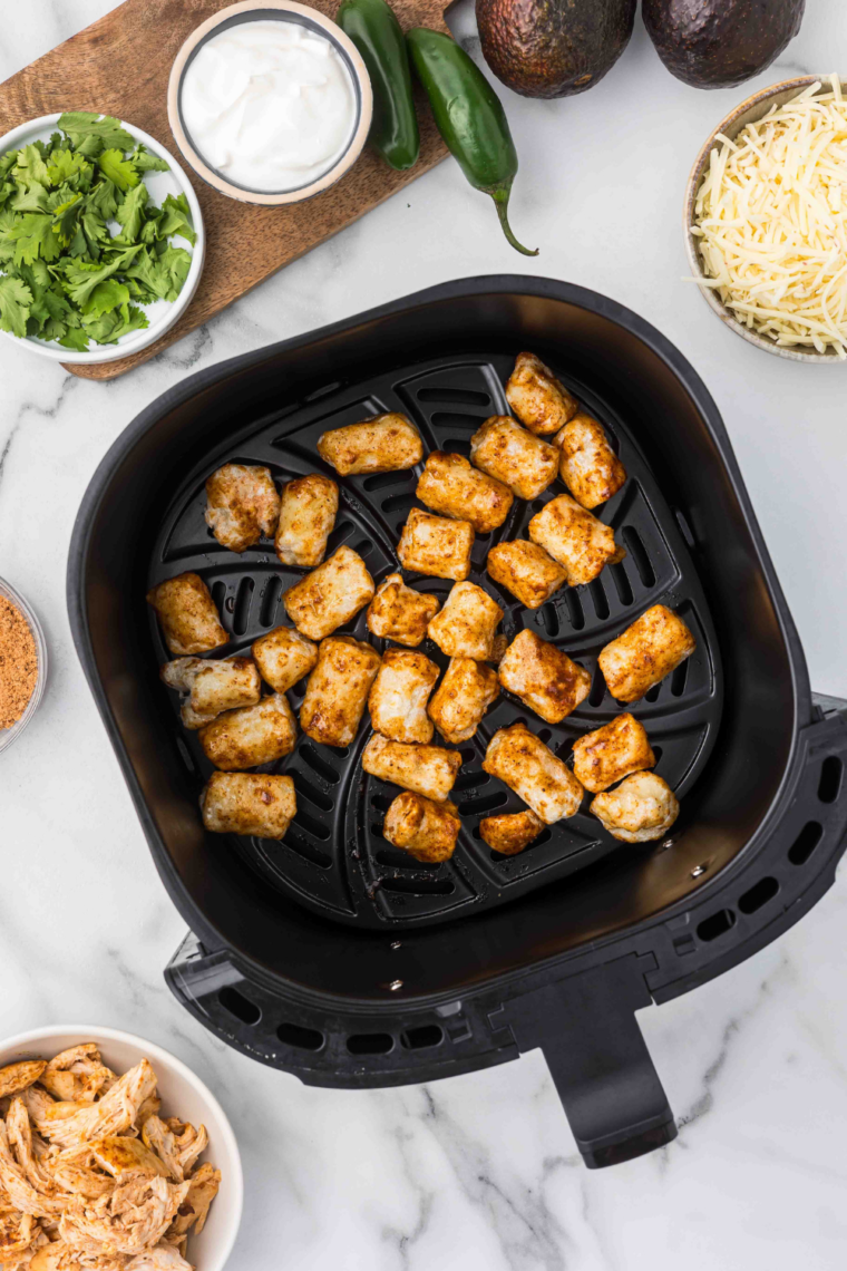 "Trader Joe's Cauliflower Gnocchi in an air fryer basket."