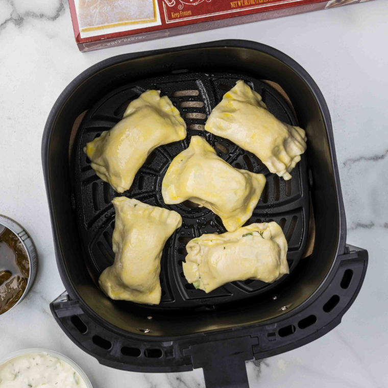 Stuffed Grape Leaves in air fryer basket, in a single layer.