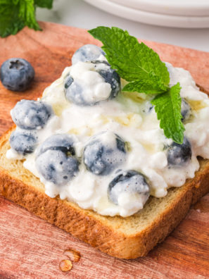 Quick and Easy Preparation: This recipe comes together in minutes, making it perfect for busy mornings when you want something nutritious without the hassle. Nutritious Ingredients: With protein-rich cottage cheese and antioxidant-packed blueberries, this toast offers a healthy start to your day. Versatile Toppings: You can customize your toast with various toppings like nuts, seeds, or honey to suit your taste and dietary preferences. Delicious Flavor Combination: The creamy cottage cheese paired with the sweet, juicy blueberries creates a delightful contrast that's sure to satisfy your taste buds. Great for Any Meal: While perfect for breakfast, this toast can also be enjoyed as a snack or light lunch, making it a versatile option for any time of day.