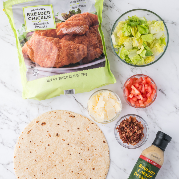Discover the key ingredients needed for Air Fryer Caesar Wraps, including frozen chicken tenders, romaine lettuce, Caesar dressing, and more, to create a quick and delicious meal