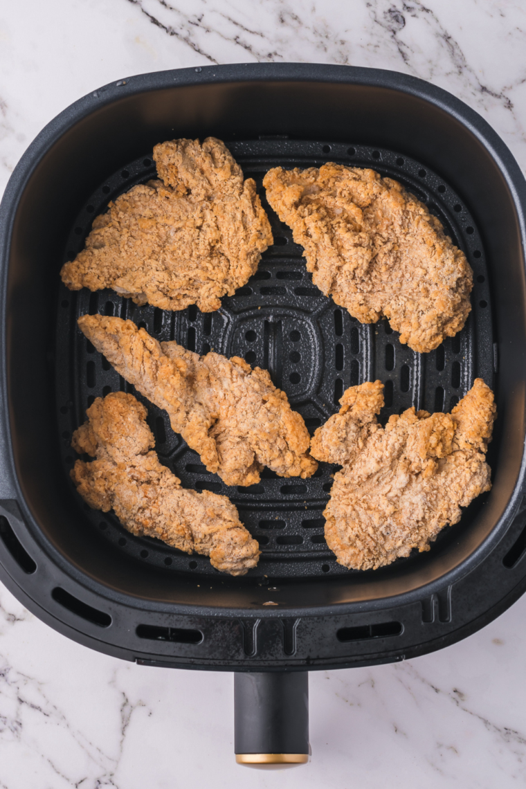 Place frozen chicken tenders in the air fryer basket.