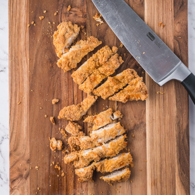 Cut the chicken into pieces for filling of the wrap.